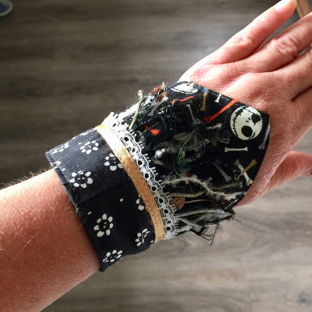 Handmade textile art wide cuff skull bracelet